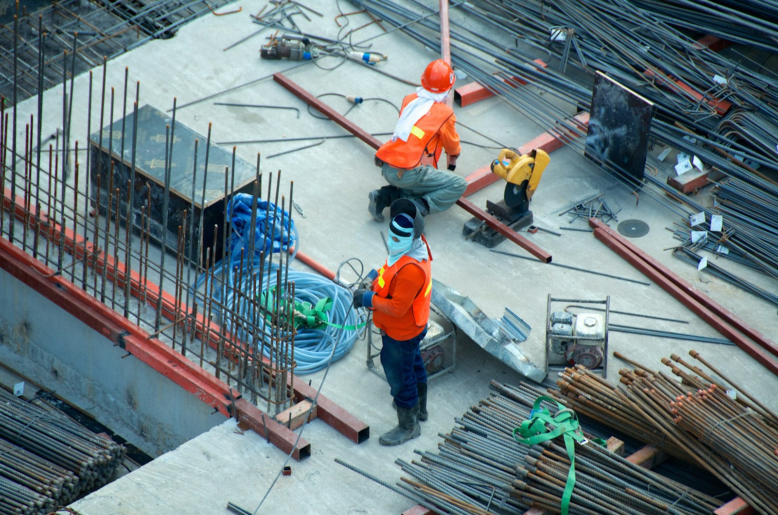 Construction workers in safety gear at a worksite